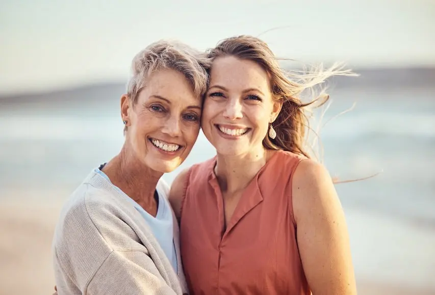 A mother and her daughter smiling