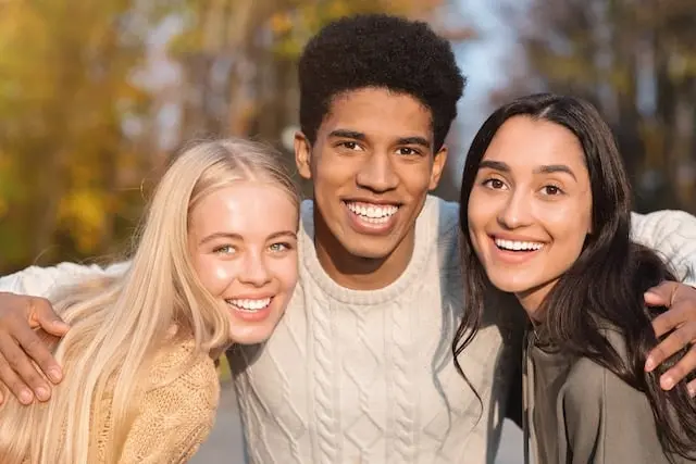 Three friends laughing together