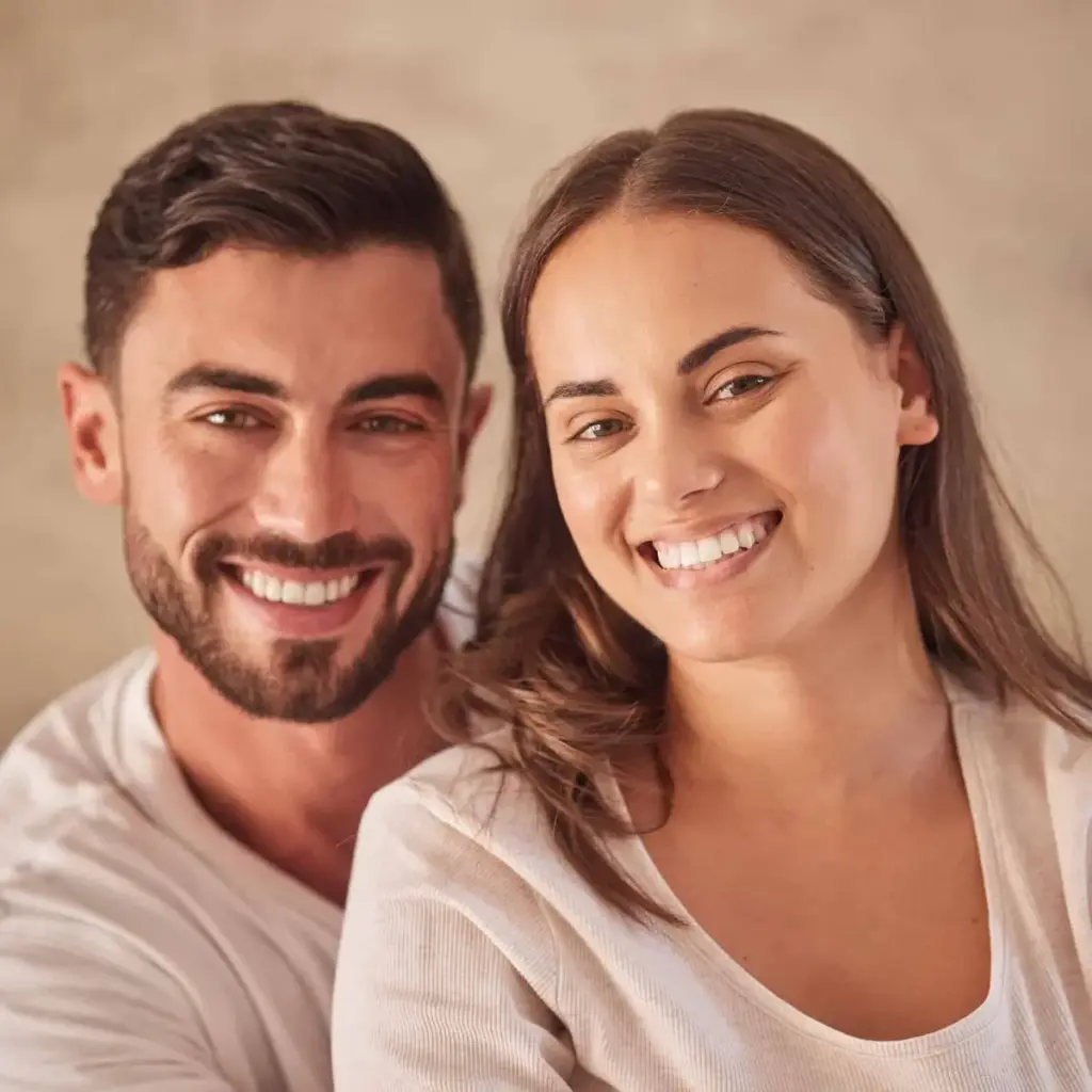 A couple smiling together outdoors
