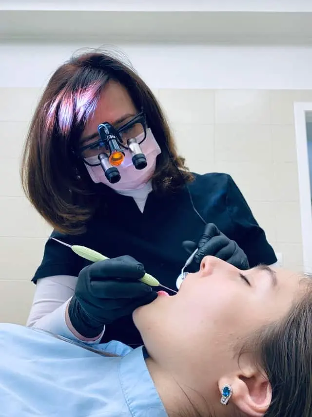 A porcelain crown being fitted
