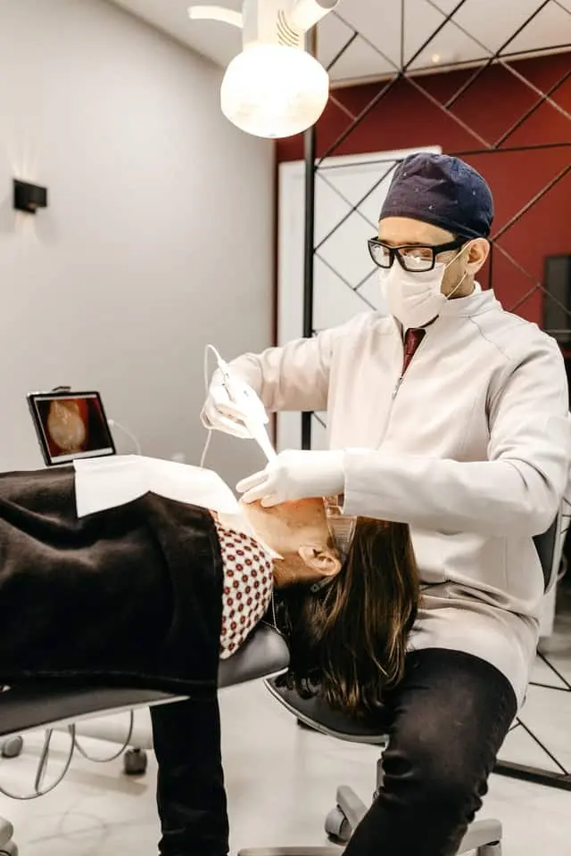 A man holding his jaw in pain