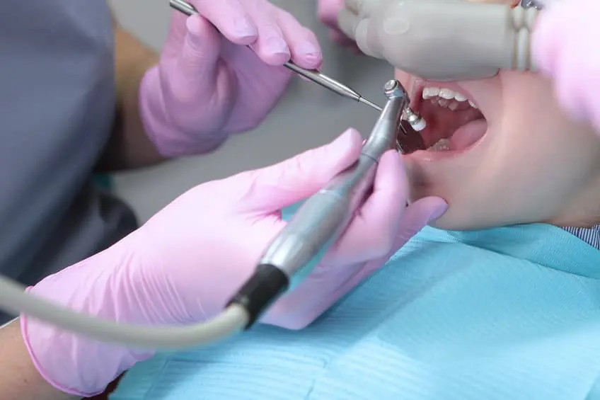 A relaxed patient reclined in a dental chair