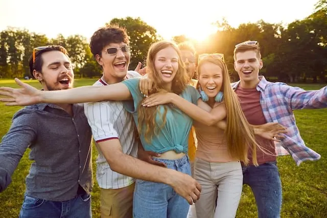 A group of friends smiling outdoors